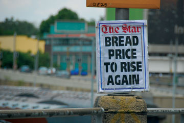 A poster that reads "Bread price to rise again"
