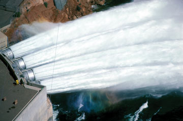 Water spews from the Glen Canyon Dam