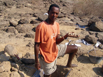Amanuel Beyin holding shells