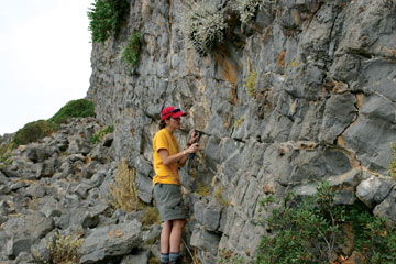 Catherine Powers with ancient ocean sediments in Hydra, Greece