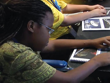 Blind students evaluate Braille book